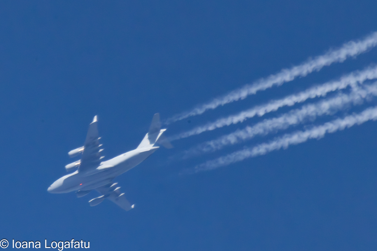 Airplane trails in blue sky